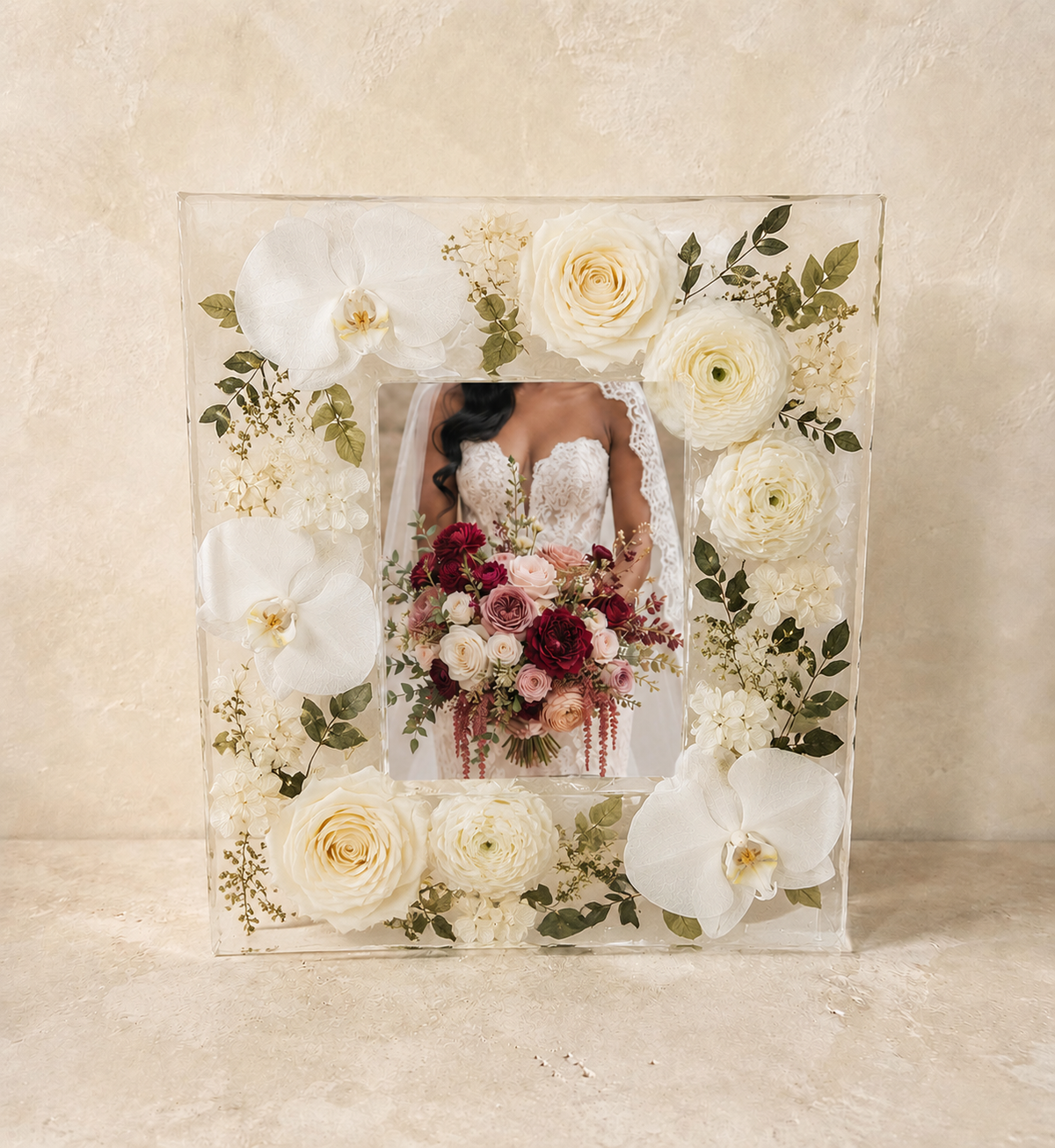 8 by 10 resin wedding flower preservation photo frame with ivory orchids, roses and greenery