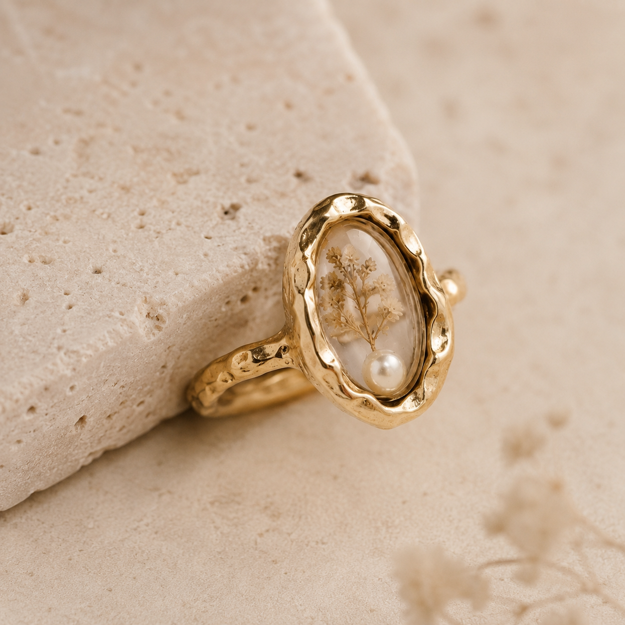 Le Rosse Studio gold single petal botanical relic ring with preserved petal and pearl in a clear oval setting