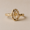 Le Rosse Studio gold wedding flower botanical relic ring with preserved dried botanical inside a clear oval setting