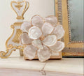Handmade oyster-shell magnolia with gold edges on included square support