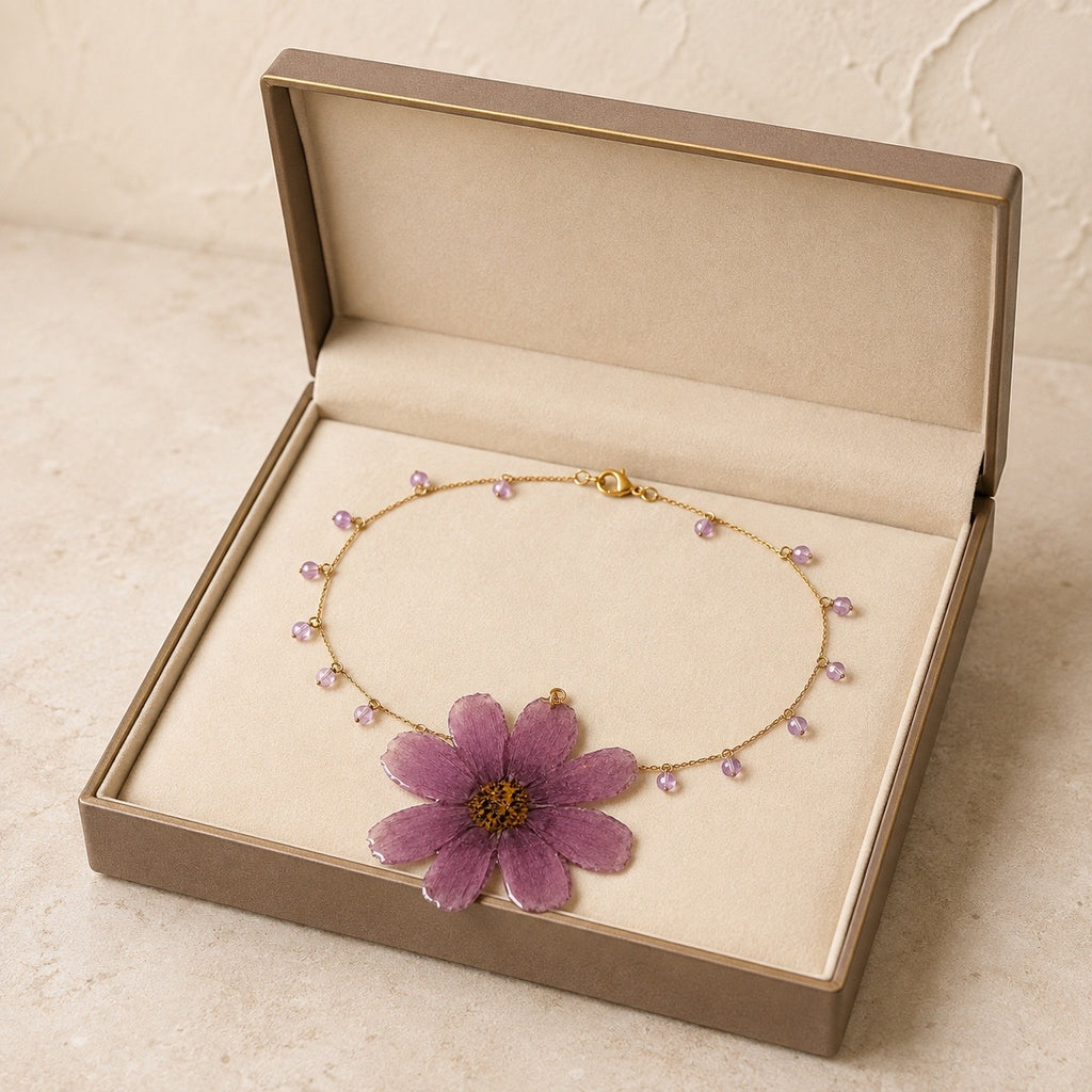 Purple preserved flower necklace presented in a luxury jewelry box