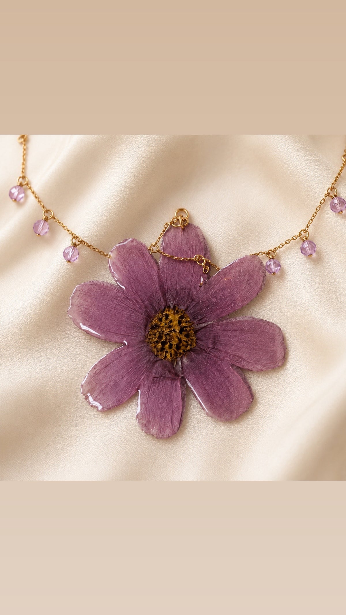 Editorial product image of purple preserved flower necklace on ivory silk